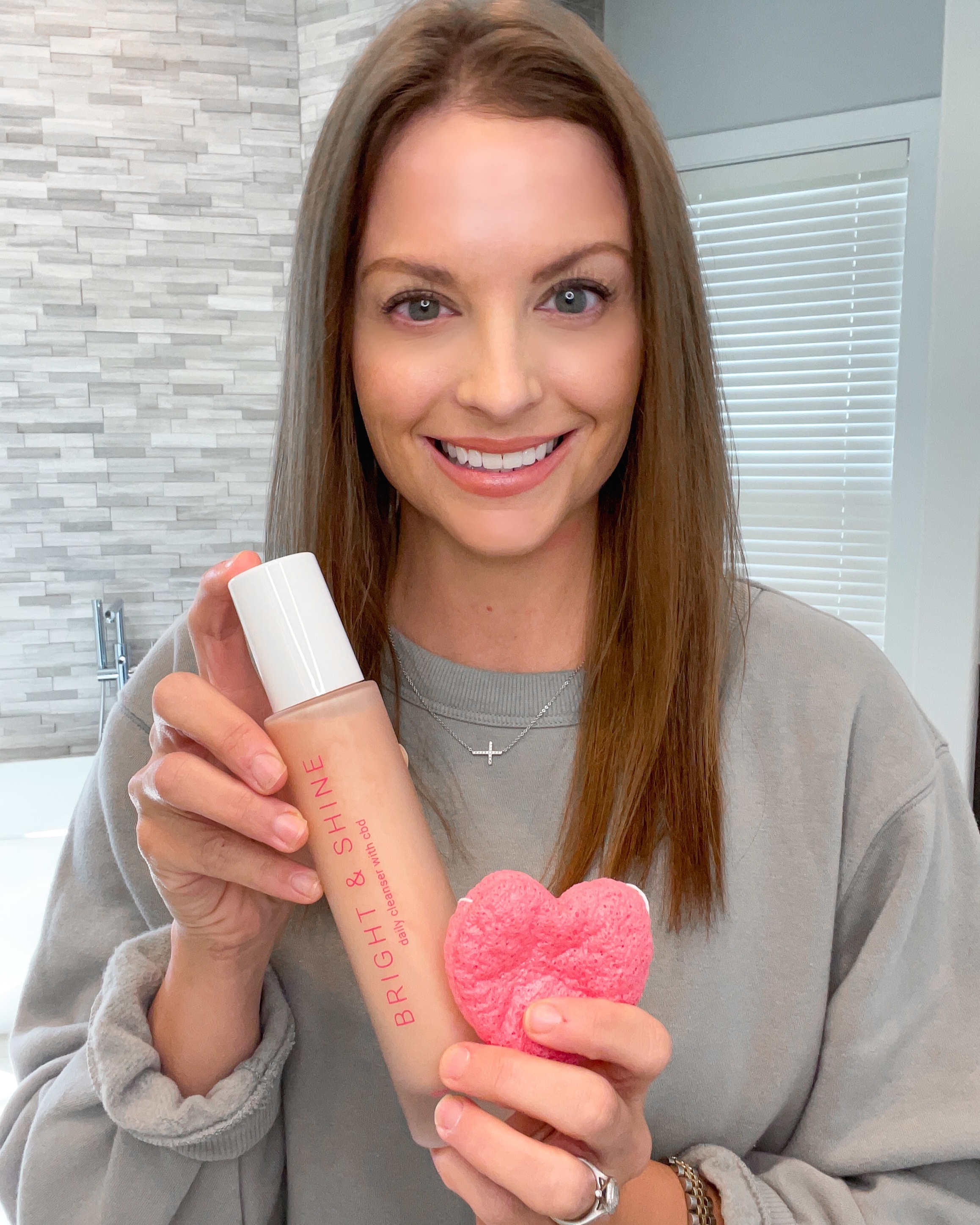 Blogger Lauren Elise with Switch 2 Pure Bright & Shine Cleanser and Heart Konjac Sponge
